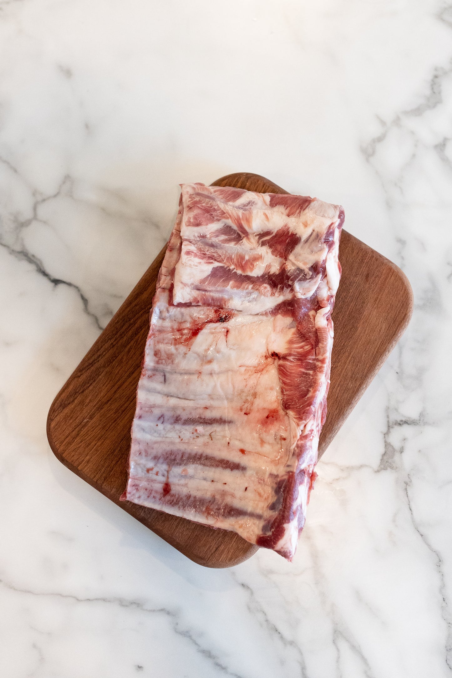 Raw St Louis Ribs;Close-up of fresh pork with visible marbling