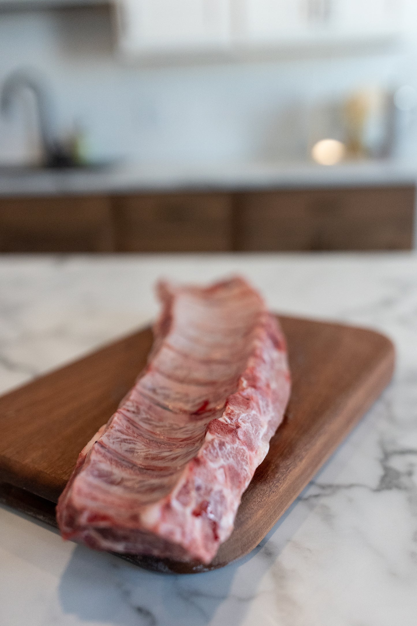 baby back ribs laying on cutting board