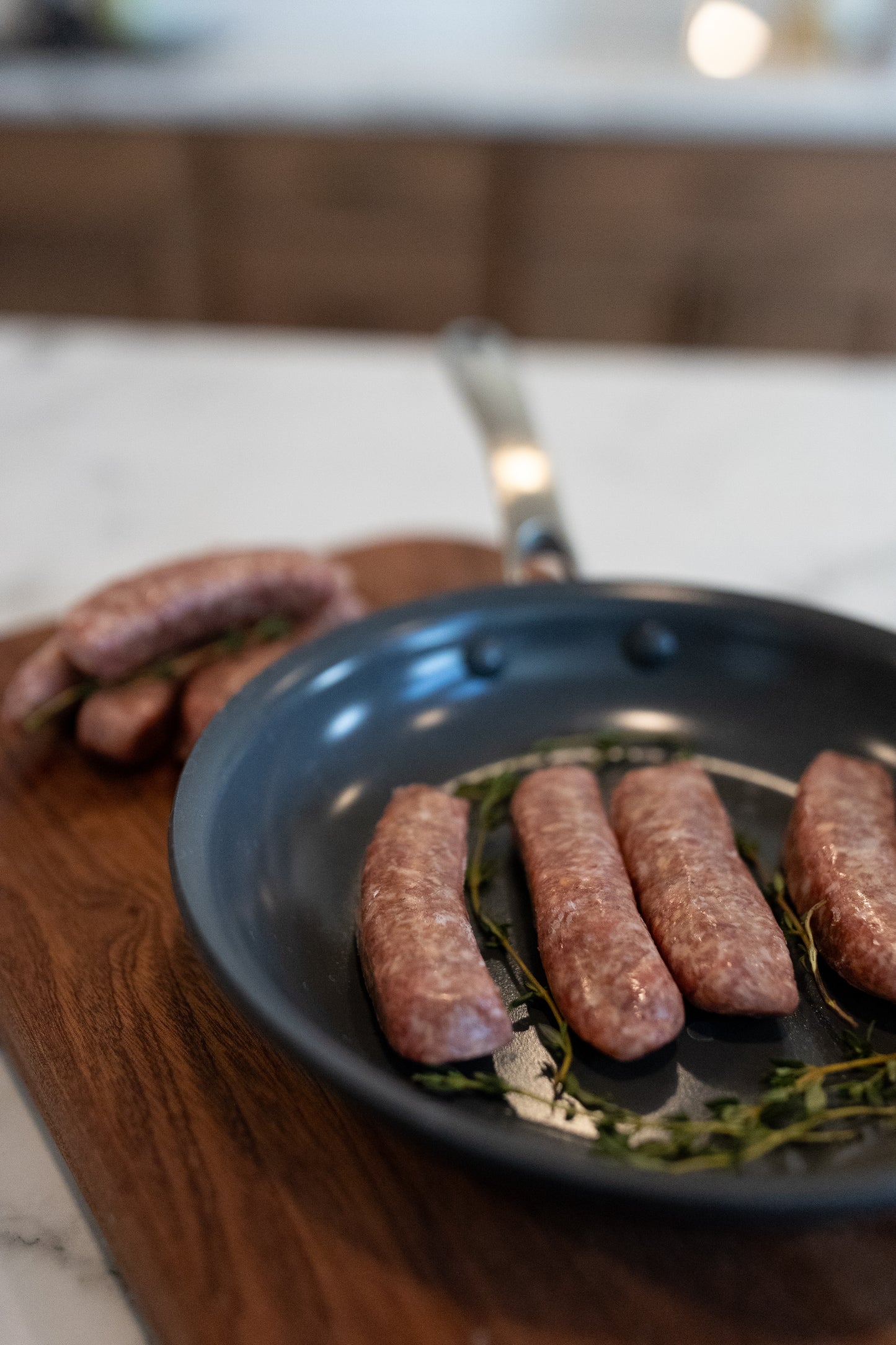 Sausage links in a pan; Freezer stocked with farm-raised pork products