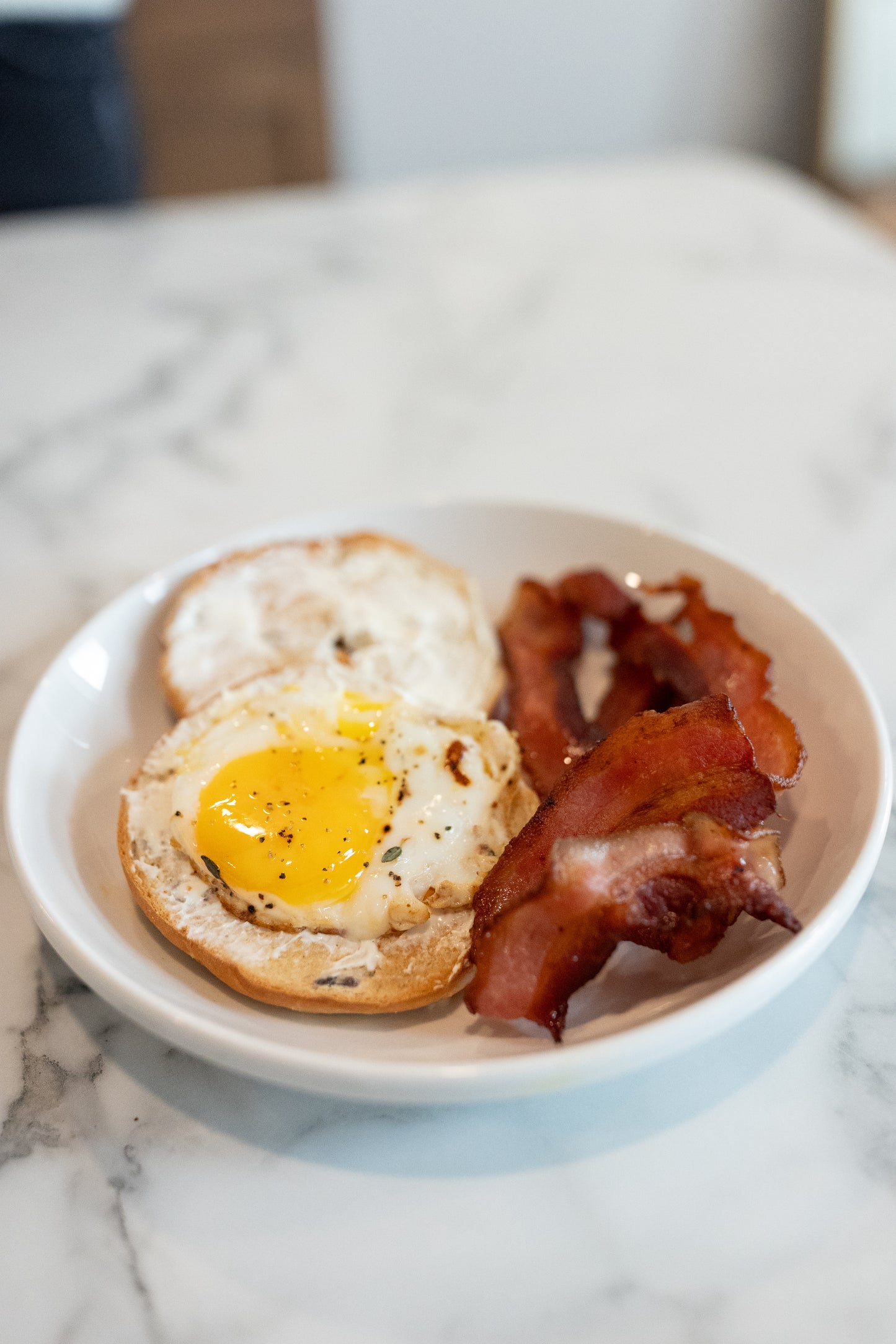 Bacon and bagel on a plate ready to eat