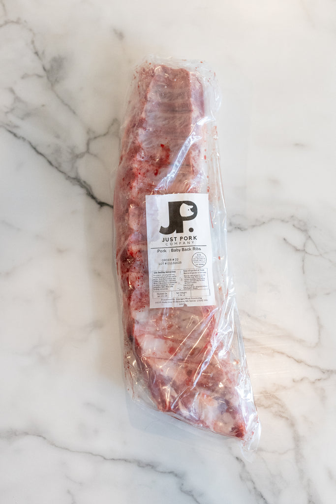 Just Pork's Baby back ribs in a package; Clean, locally raised pork ready to cook